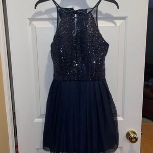 Like new navy blue women’s halter top homecoming dress.